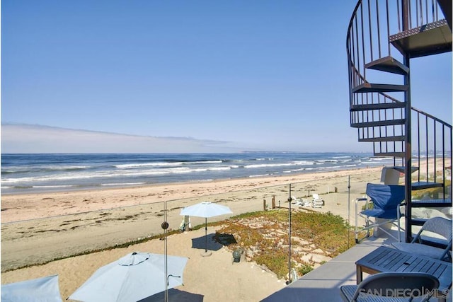 property view of water featuring a beach view