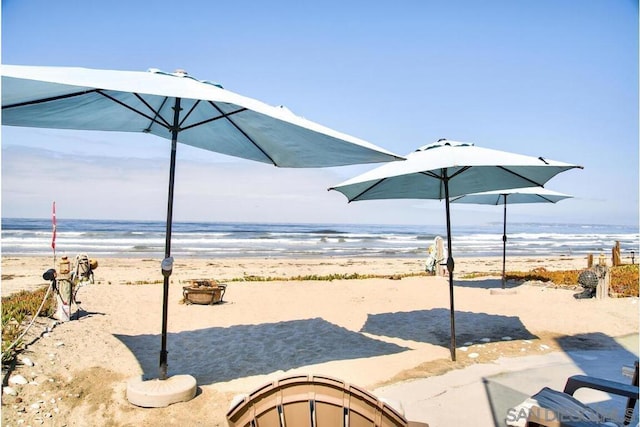 view of water feature with a beach view