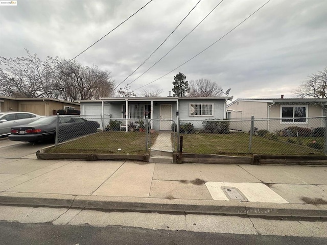 view of front of home featuring a garage and a front yard