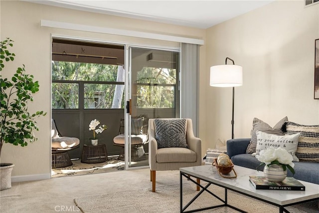 living area with carpet flooring