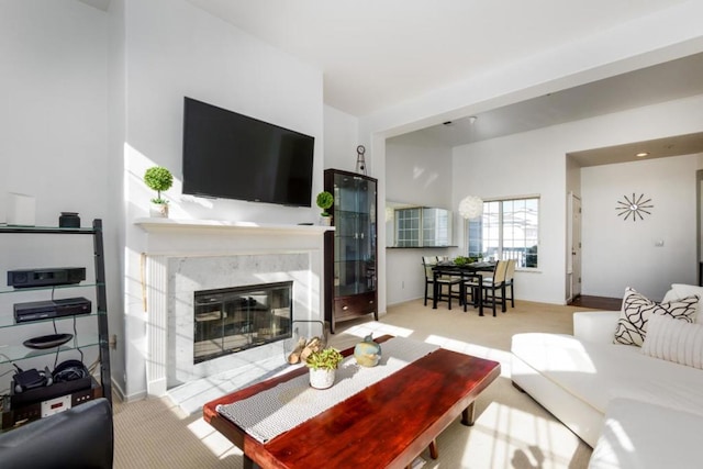 carpeted living room with a fireplace