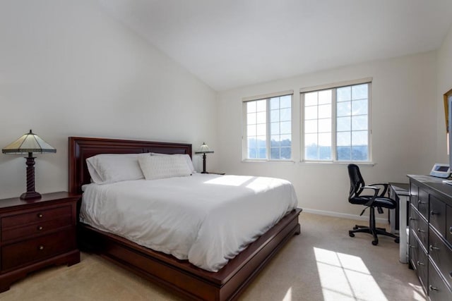 carpeted bedroom featuring vaulted ceiling