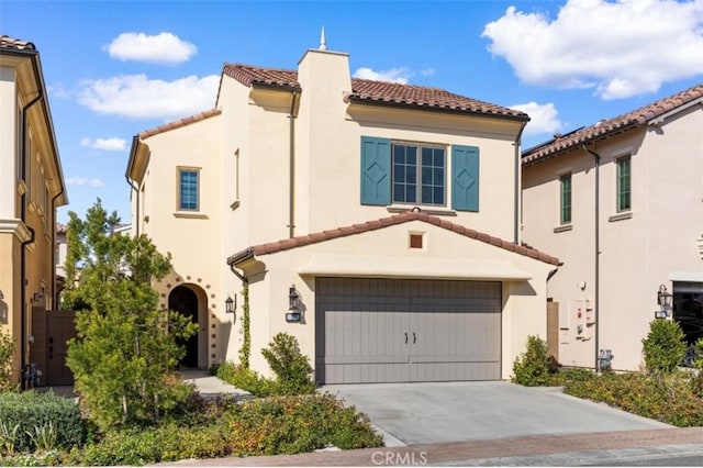 mediterranean / spanish-style house featuring a garage