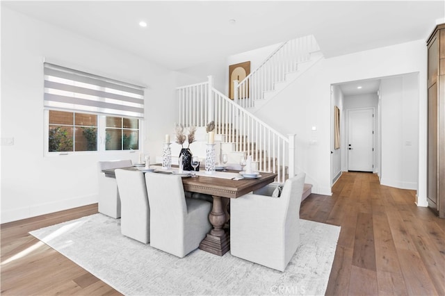 dining space with light hardwood / wood-style floors