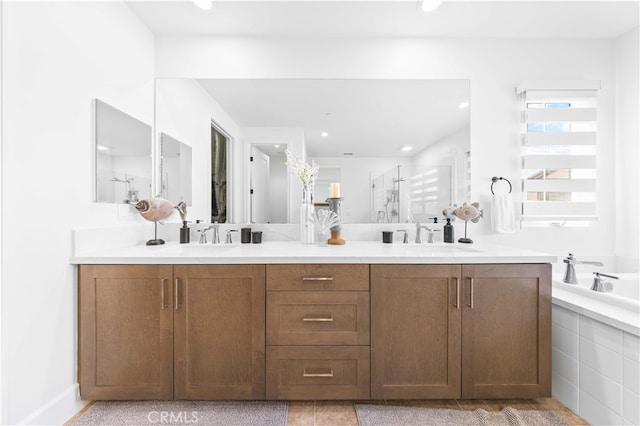 bathroom with independent shower and bath and vanity