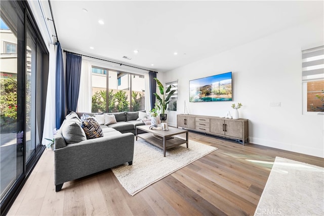 living room with light hardwood / wood-style floors