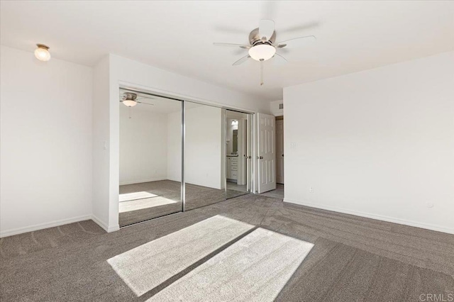 unfurnished bedroom with a closet, ceiling fan, and carpet