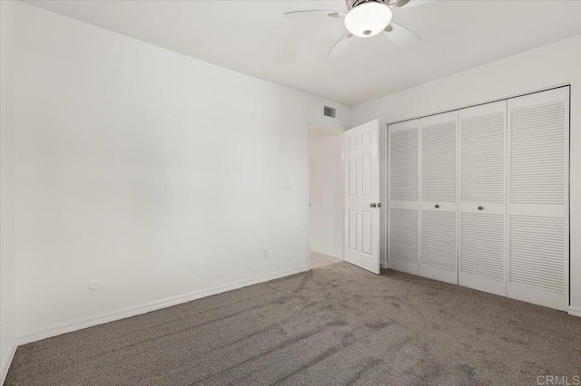 unfurnished bedroom featuring carpet flooring, ceiling fan, and a closet