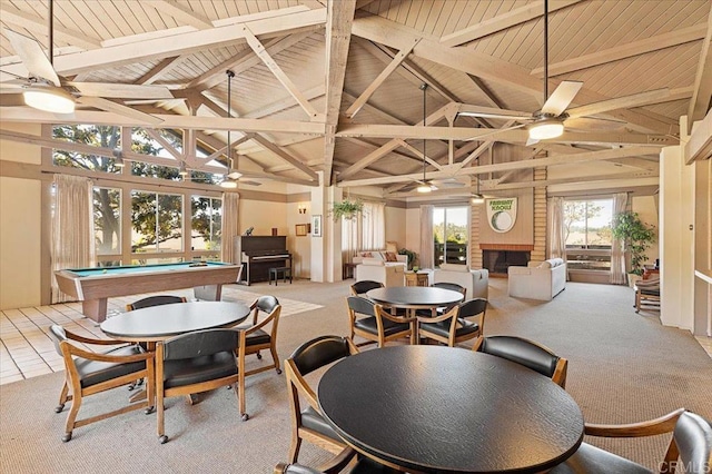 carpeted dining space with wood ceiling, beam ceiling, pool table, and ceiling fan