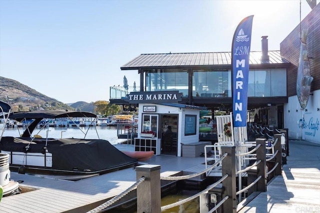 dock area with a water and mountain view