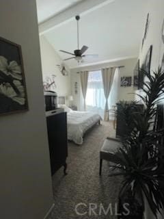 carpeted bedroom with lofted ceiling with beams and ceiling fan