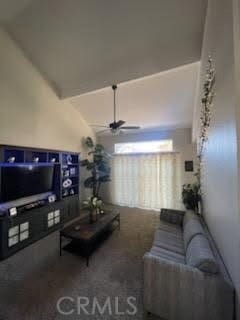 living room with lofted ceiling, ceiling fan, and carpet