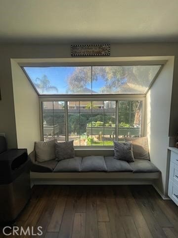 living room featuring dark wood-type flooring