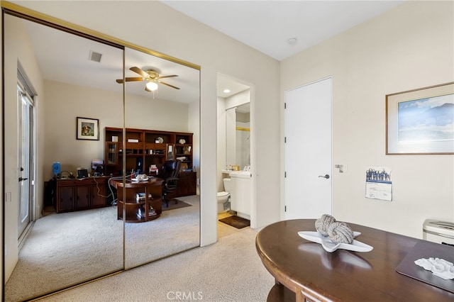 office area with carpet and ceiling fan