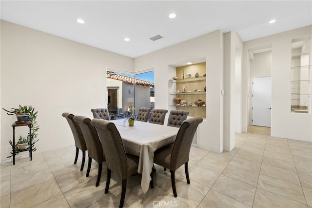 dining area with built in features, recessed lighting, visible vents, and light tile patterned flooring