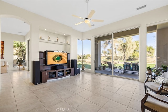 living room featuring plenty of natural light and light tile patterned floors