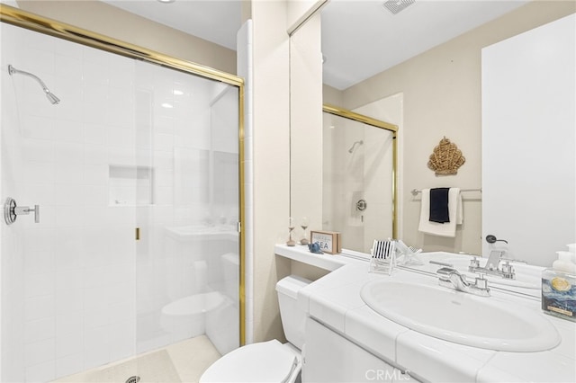 full bathroom featuring toilet, a shower stall, visible vents, and vanity