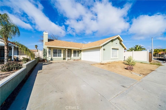 ranch-style house featuring a garage