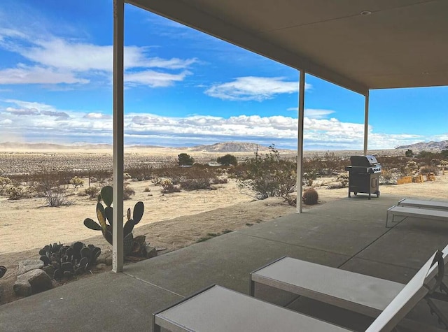 view of patio with a grill