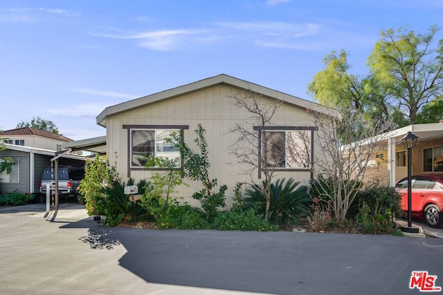 view of home's exterior featuring a carport