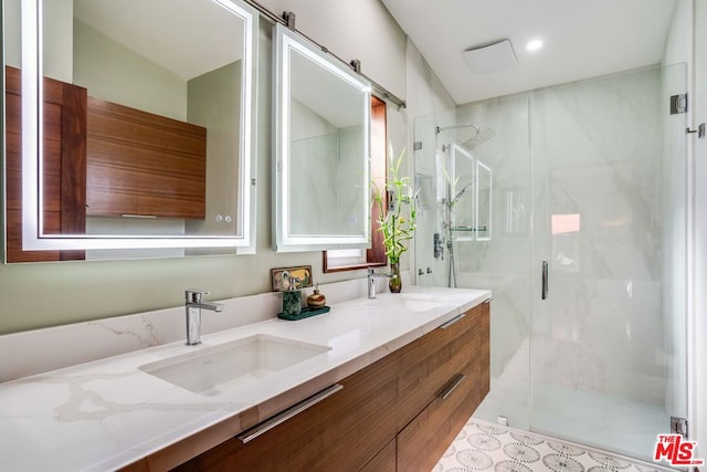 bathroom with vanity and a shower with shower door