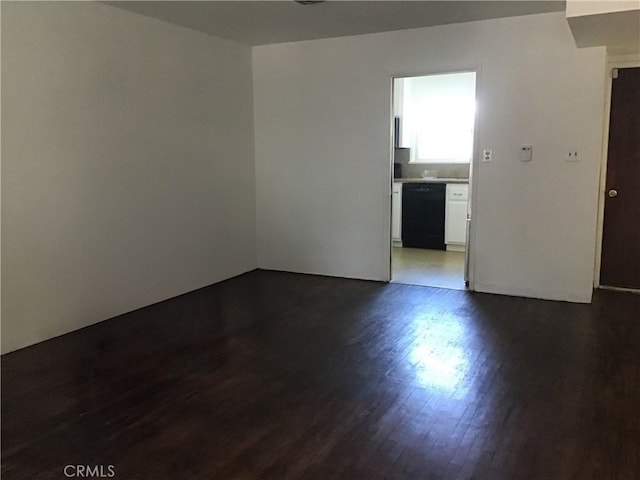 empty room with dark wood-style floors