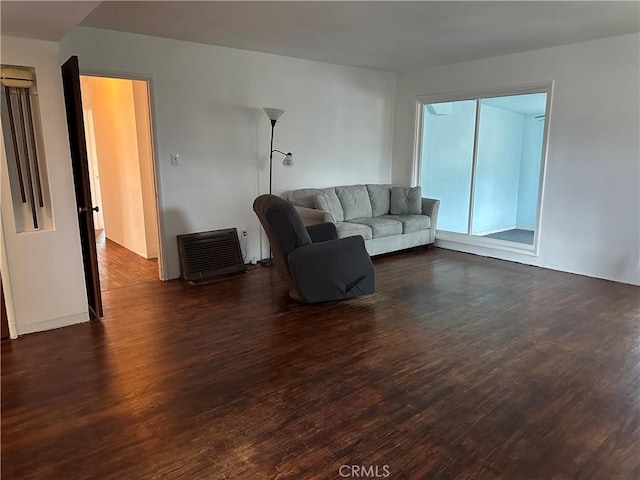 living area featuring dark wood-style floors