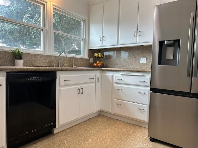 kitchen featuring a sink, white cabinetry, stainless steel refrigerator with ice dispenser, and dishwasher