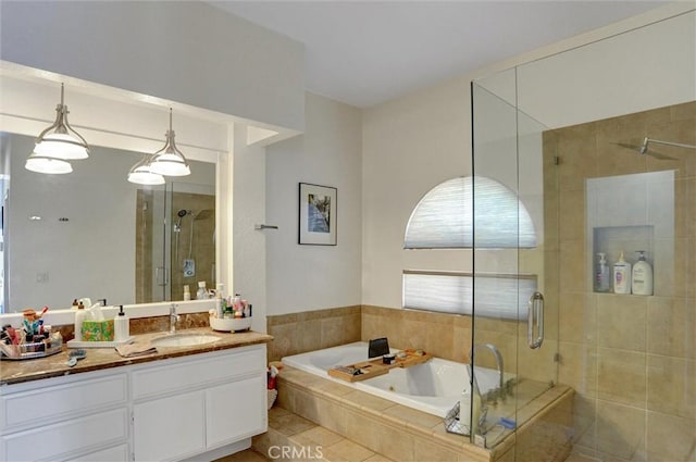 bathroom featuring vanity, tile patterned floors, and plus walk in shower