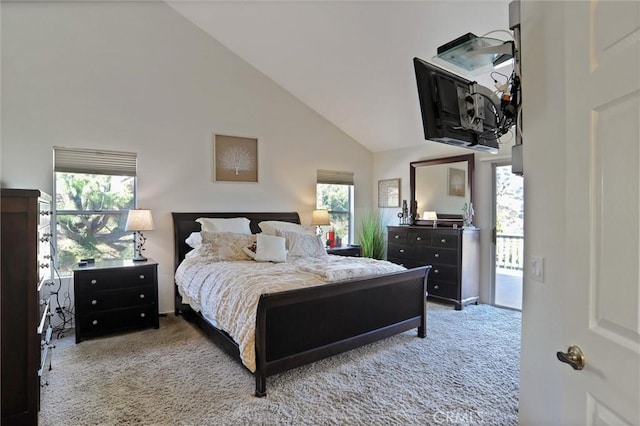 carpeted bedroom featuring high vaulted ceiling, multiple windows, and access to outside