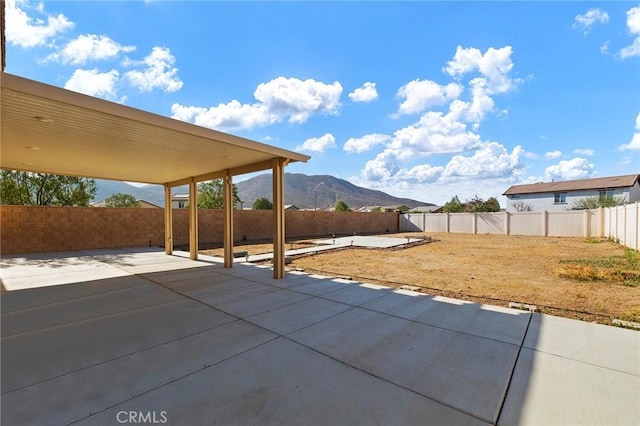 view of patio / terrace featuring a mountain view