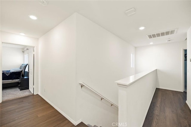 hallway with dark wood-type flooring