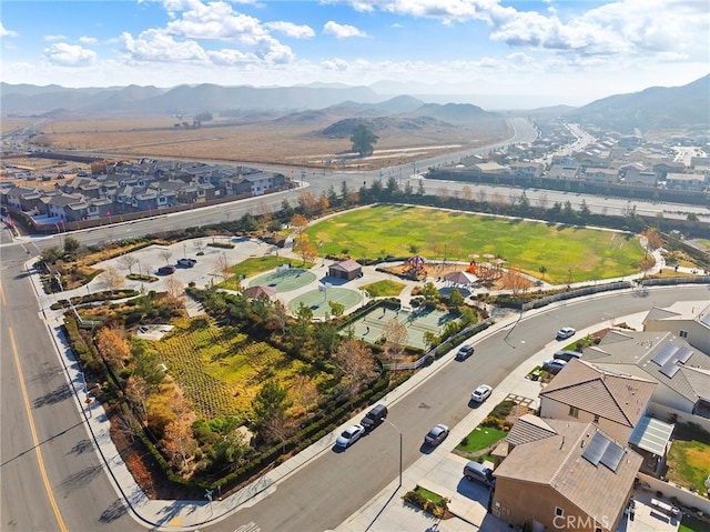 birds eye view of property with a mountain view