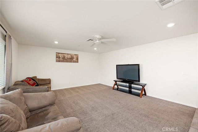 carpeted living room featuring ceiling fan