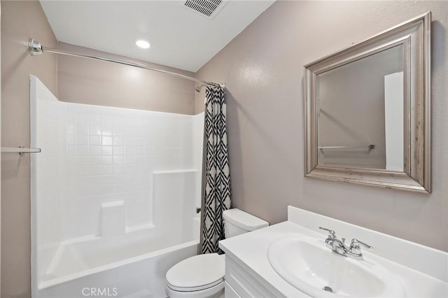 full bathroom with vanity, shower / tub combo, and toilet