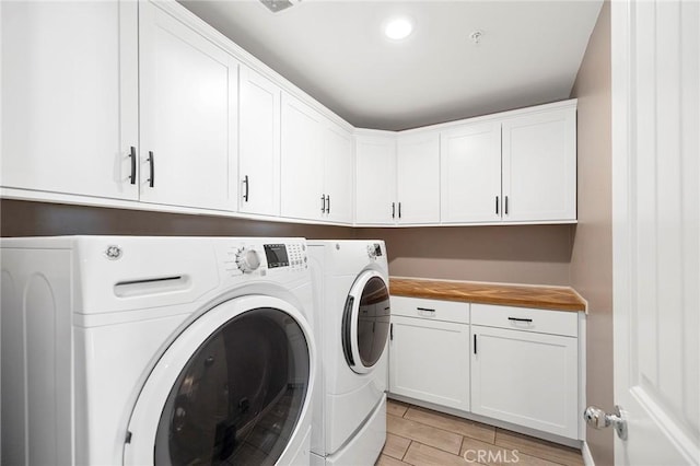 laundry area with cabinets and washer and dryer