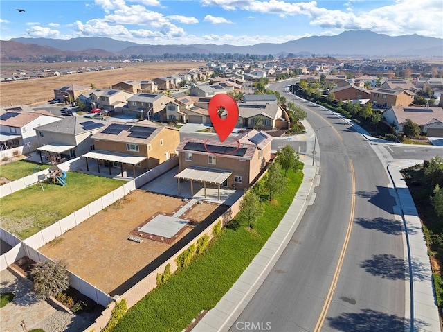 birds eye view of property with a mountain view