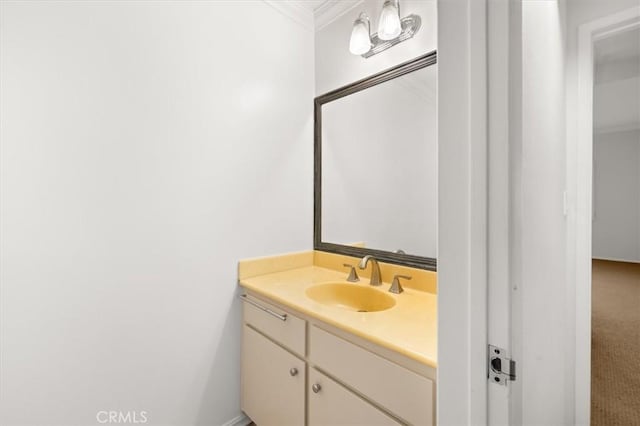 bathroom featuring vanity and crown molding