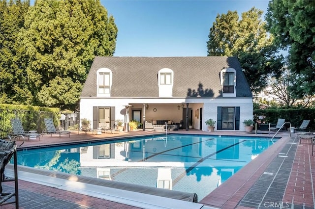 view of swimming pool with a patio area