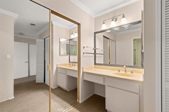 bathroom featuring ornamental molding and vanity