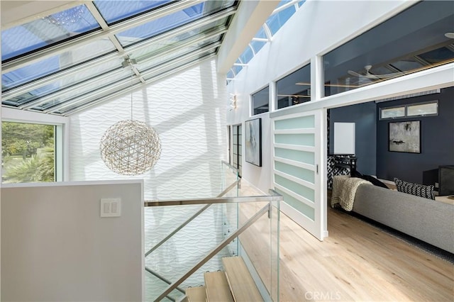 stairs with hardwood / wood-style floors