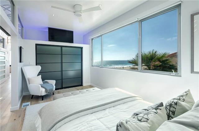 bedroom featuring ceiling fan and light wood-type flooring