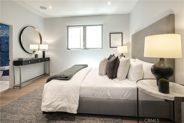 bedroom featuring light hardwood / wood-style floors