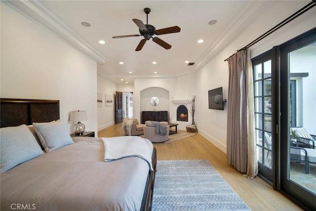 bedroom with crown molding and light wood-type flooring