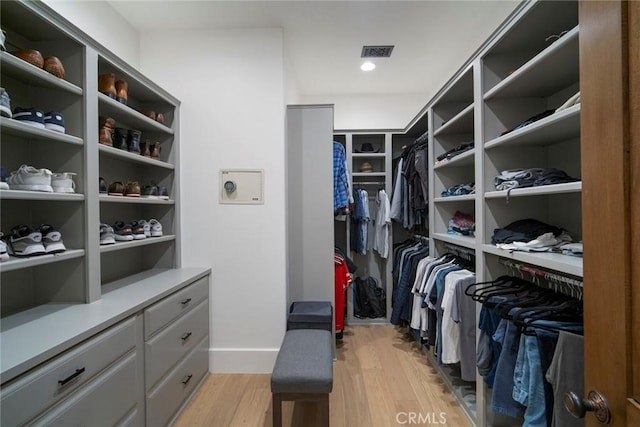 spacious closet featuring light wood-type flooring