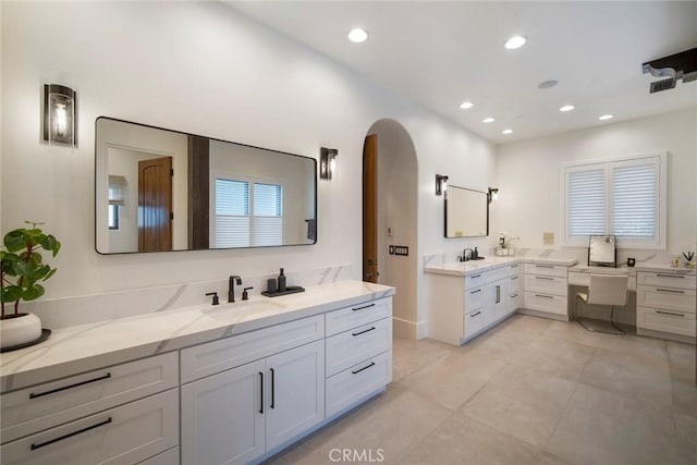 bathroom featuring tile patterned flooring and vanity