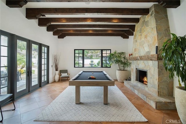 game room with light tile patterned floors, beam ceiling, a fireplace, pool table, and french doors