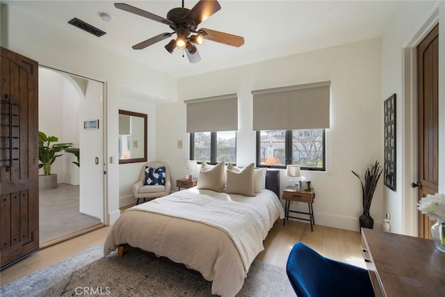 bedroom featuring ceiling fan and light hardwood / wood-style flooring