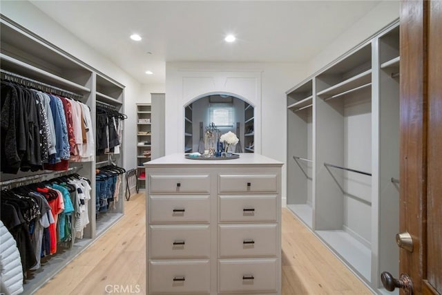 spacious closet featuring light hardwood / wood-style floors