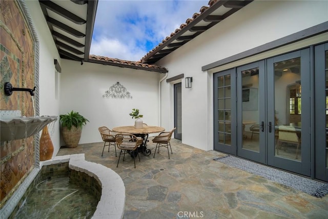 view of patio featuring french doors